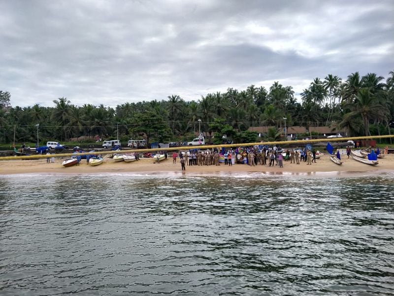Sand dredging lobster workers protest in sea at Kovalam
