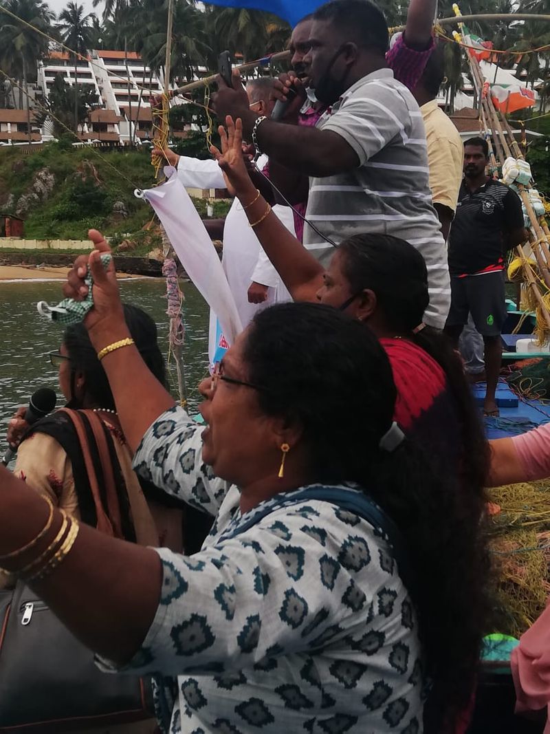 Sand dredging lobster workers protest in sea at Kovalam