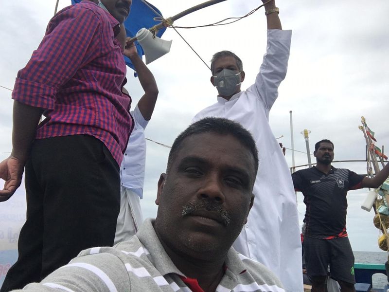 Sand dredging lobster workers protest in sea at Kovalam