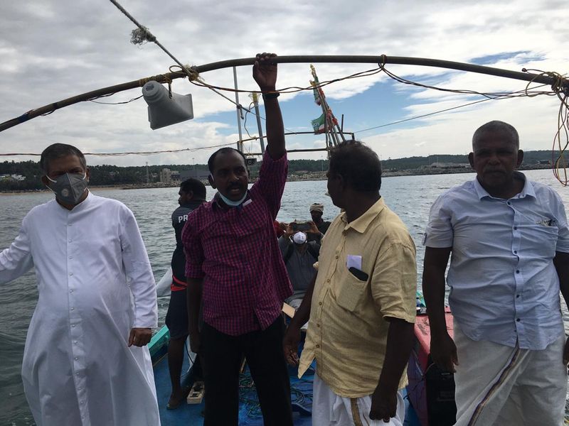 Sand dredging lobster workers protest in sea at Kovalam