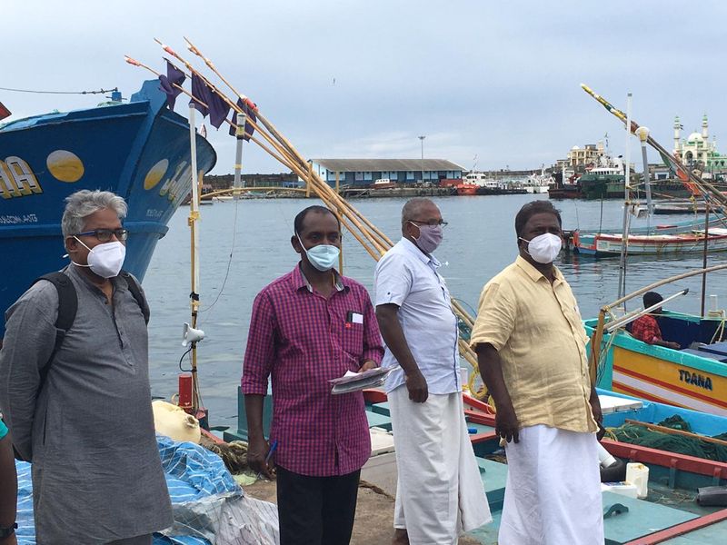 Sand dredging lobster workers protest in sea at Kovalam