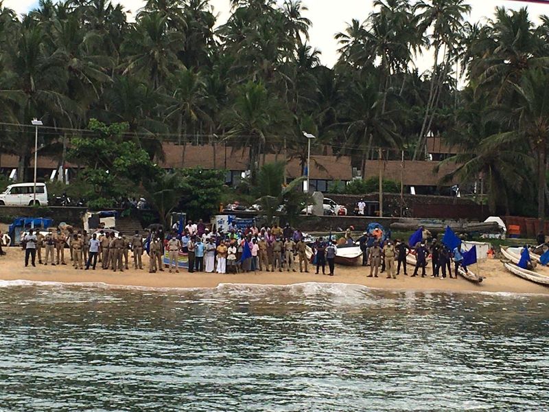 Sand dredging lobster workers protest in sea at Kovalam