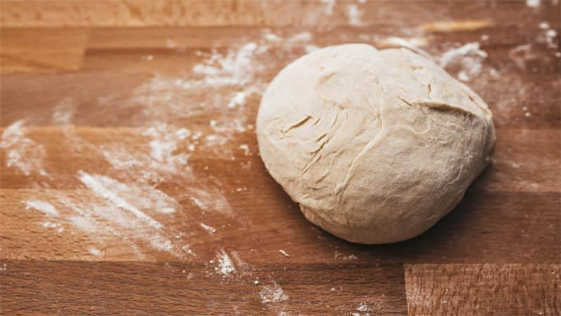 When should oil and ghee be added to the dough for roti and paratha ram 