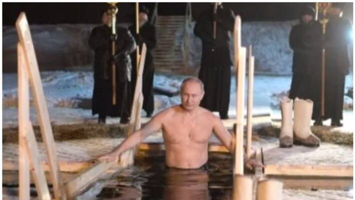 Putin takes dip in icy lake to mark Orthodox Epiphany Putin takes dip in icy lake to mark Orthodox Epiphany