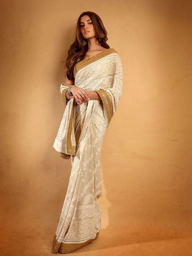 Tara Sutaria
SOTY 2 actress Tara Sutaria looked dead drop gorgeous in the white and golden bordered chikankari saree. She kept her makeup minimal, wore statement ring, bangle and earring to complete the look.