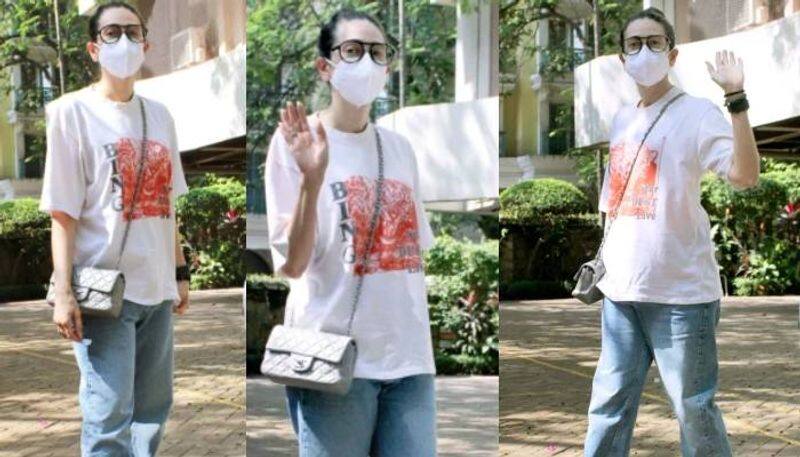 Karisma Kapoor in tshirt and denims with Rs 2.9 lakh bag