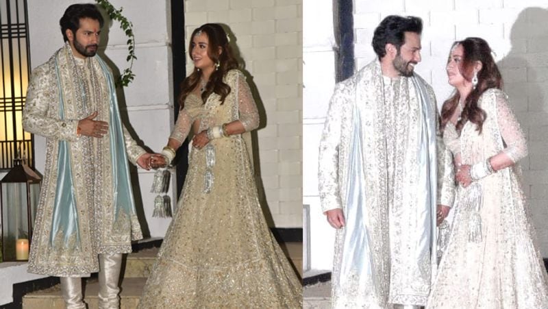 अपनी जिंदगी के इस खास दिन पर दोनों ने मैचिंग कपड़े पहने जिसमें वो काफी अच्छे लग रहे थे। अगर वरुण की बात करें तो उन्होंने गोल्ड फ्लोरल वर्क वाली ऑफ व्हाइट शेरवानी पहनी थी, जिस सोने के फूलों की कढ़ाई थी। इसके साथ उन्होंने रेशम के पजामा पहना था। कलर कॉम्बिनेशन के साथ एक नीले रंग का दुपट्टा ले रखा था, जो शेरवानी के बॉर्डर और मोजरी से मैच कर रहा था।