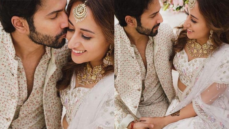 मेहंदी सेरेमनी में वरुण अपनी दुल्हनिया को किस करते नजर आए। जैसे ही वरुण ने नताशा का माथा चूमा उन्होंने शरमाकर अपनी आंखें नीचे कर ली।