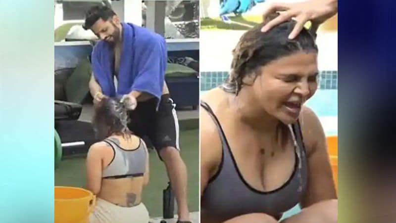 प्रोमो में देखा जा सकता है कि राहुल अपने हाथों से राखी के ऊपर मग से पानी डाल रहे हैं। साथ ही वो राखी के बालों को शैंपू से धो भी रहे हैं।