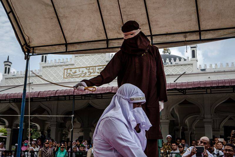 Two gay men publicly caned 77 times by religious police in Indonesia