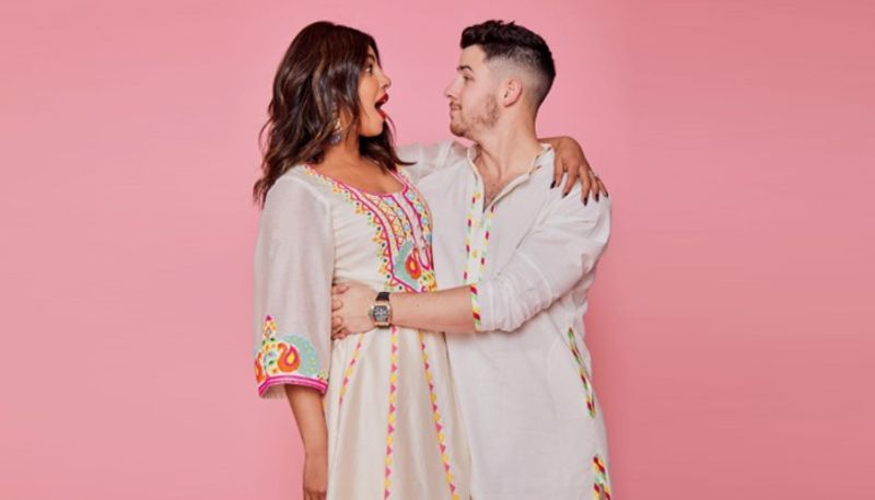Priyanka Chopra-Nick Jonas
The global sweethearts Priyanka and Nick wore white and multi-coloured stitched kurta on Holi last year. They looked absolutely stunning in twinning outfits.
