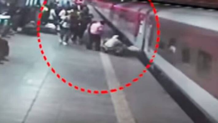 Maharashtra RPF personnel saved a man from slipping into platform gap while boarding a moving train, Watch video - gps Maharashtra RPF personnel saved a man from slipping into platform gap while boarding a moving train, Watch video - gps