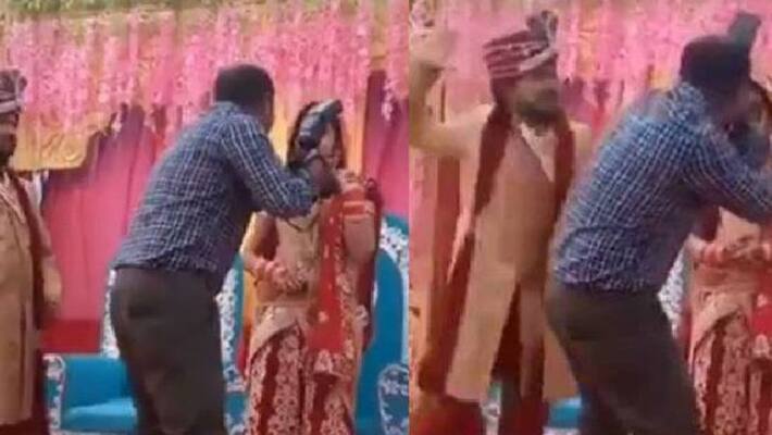 Groom smacks cameraman during wedding photoshoot Groom smacks cameraman during wedding photoshoot