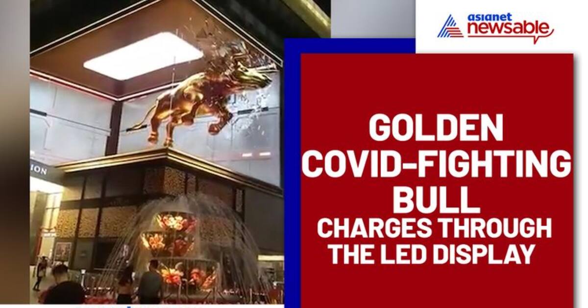 Bull charges out of a large screen in Kuala Lumpur; video