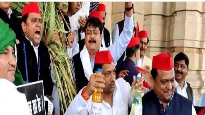 Budget session begins amidst uproar in UP, e-budget will be presented on 22nd, SP leaders arrive with petrol and diesel in bottles in Vidhan Bhavan asa Budget session begins amidst uproar in UP, e-budget will be presented on 22nd, SP leaders arrive with petrol and diesel in bottles in Vidhan Bhavan asa