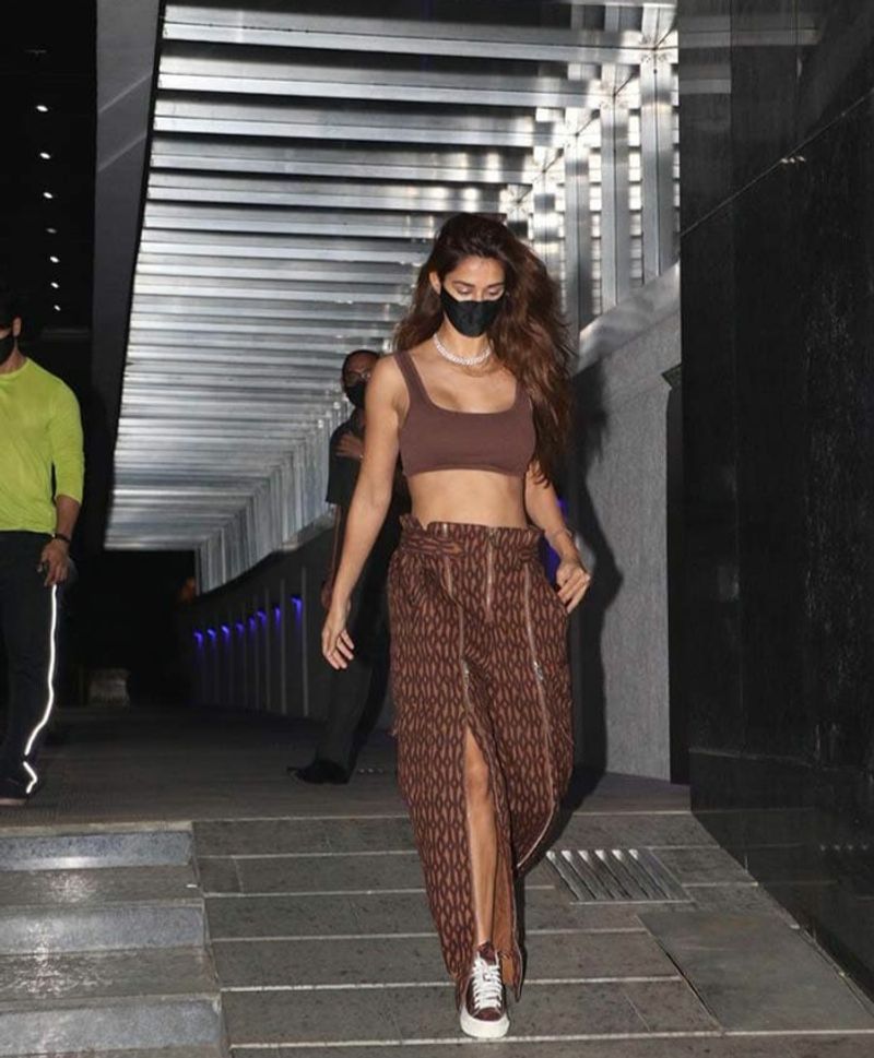 Disha Patani donned in casual wear with matching separates and sneakers. She accessorises her casual dress with a choker.
