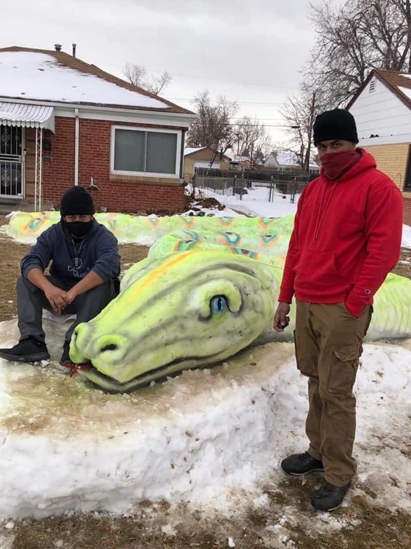 Morn Mosley and family created snake snow sculpture