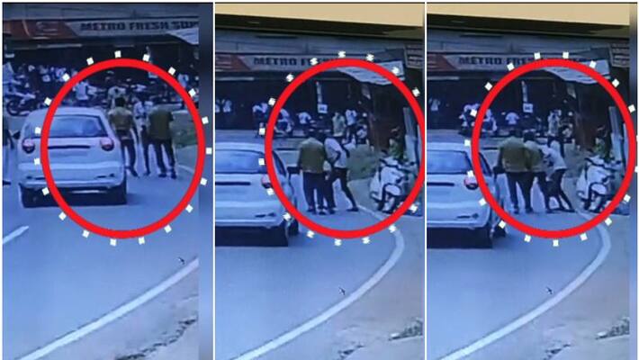 student beaten up by auto driver in roadside kannur cctv visuals student beaten up by auto driver in roadside kannur cctv visuals