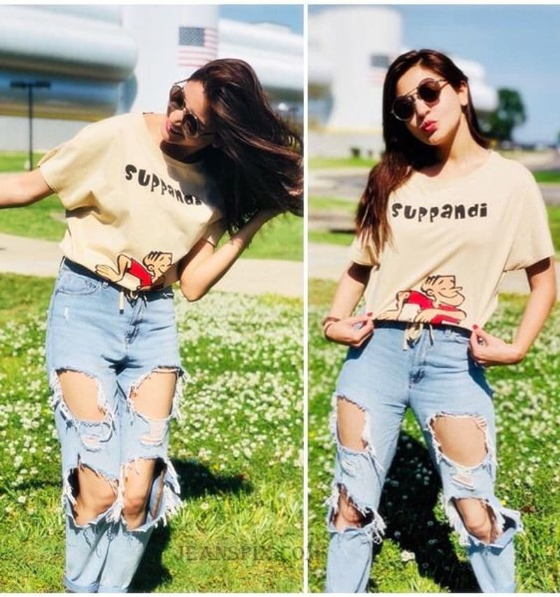 <p style="text-align: justify;"><strong>Anushka Sharma</strong><br />
Anushka Sharma's quirky ripped jeans look is worth recreating. She wore a beige 'Suppandi' graphic printed t-shirt with ripped blue jeans.</p>
