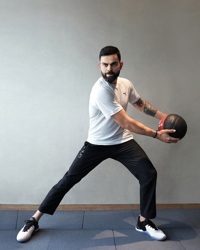 Earlier, on Friday, he had shared a couple of his classy looks. In this, he poses with a ball in hand, wearing a white t-shirt and black trouser.