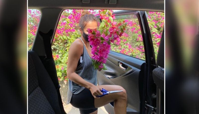 Today, she posted a picture where we can see her getting inside a car holding a pair of scissor. She captioned it,"Phoool chor ....... 😉😉😝😂🤣 ( spring is here)" It means she is stealing flowers from the tress...hmm naughty girl.
