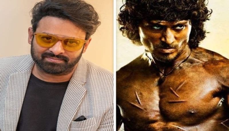 <p>ಟೈಗರ್ ತನ್ನ ಶೂಟಿಂಗ್ಗಳಲ್ಲಿ ತುಂಬಾ ಬ್ಯುಸಿಯಾಗಿದ್ದಾರೆ ಮತ್ತು ರಾಂಬೊಗೆ ಯಾವುದೇ ಡೈಟ್ ಹೊಂದಿಸಲು ಸಾಧ್ಯವಾಗಲಿಲ್ಲ. ಆ ಕಾರಣದಿಂದ ಬಾಹುಬಲಿ ನಟ ಪ್ರಭಾಸ್ ಈ ಸ್ಥಾನ ಪಡೆದಿದ್ದಾರೆ ಎನ್ನಲಾಗುತ್ತಿದೆ. </p>