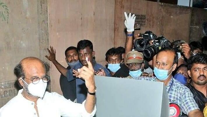 Cameraman and reporters surround rajinikanth at voting booth time viral video Cameraman and reporters surround rajinikanth at voting booth time viral video