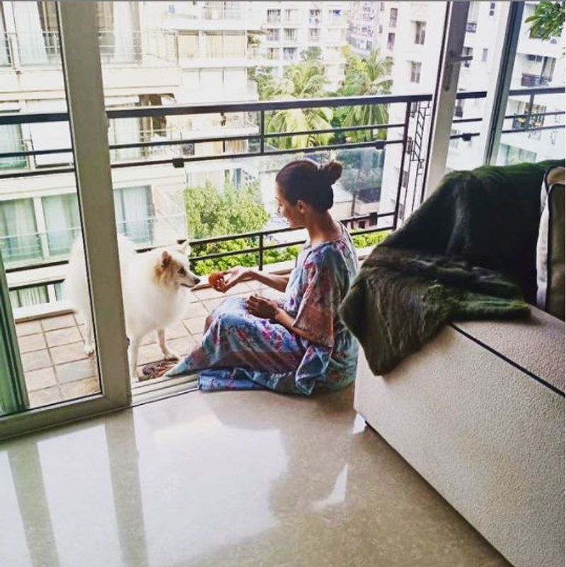 The balcony area joins with a separated living by sliding glass doors from the ceiling to the floor.