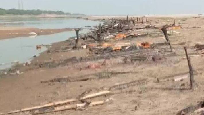 Bodies found buried in sand on banks of Ganga in UPs Prayagraj Bodies found buried in sand on banks of Ganga in UPs Prayagraj