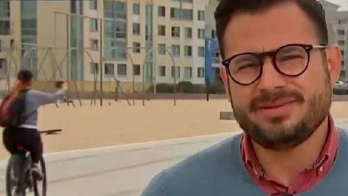 Cyclist s attempt at selfie gets caught on Live news report Cyclist s attempt at selfie gets caught on Live news report