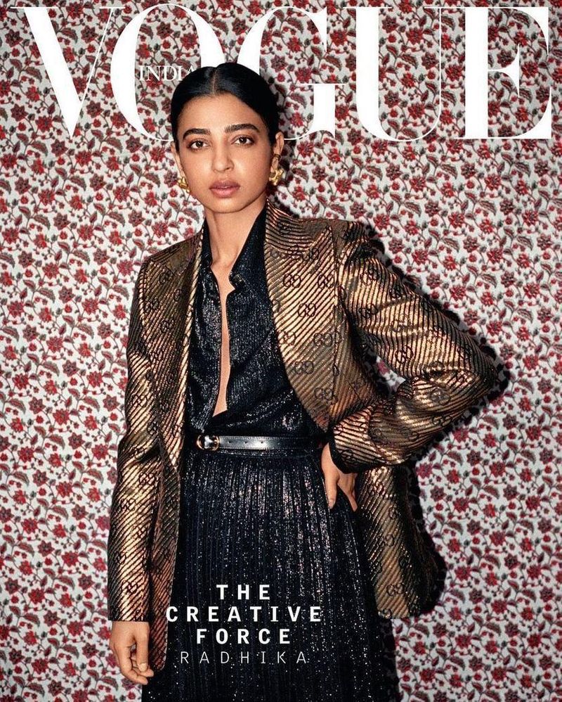 Radhika pulled off an elegant black shimmer dress with an open centre topped with a belt and paired with a golden Gucci blazer with her hair tied in a neat bun and large golden studs in the Vogue cover. (Image courtsey: PR handout)