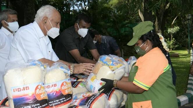 2 years of Modi 2 govt CM BS Yediyurappa distributes Food kit to PouraKarmikas hls