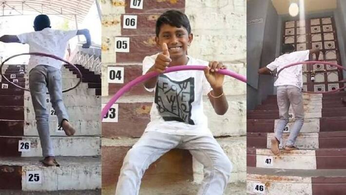 boy breaks Guinness World Record for being fastest to climb steps while hula hooping boy breaks Guinness World Record for being fastest to climb steps while hula hooping