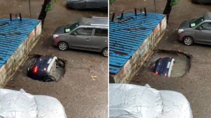 sinkhole swallowing a parked car at a housing society in Mumbais Ghatkopar sinkhole swallowing a parked car at a housing society in Mumbais Ghatkopar