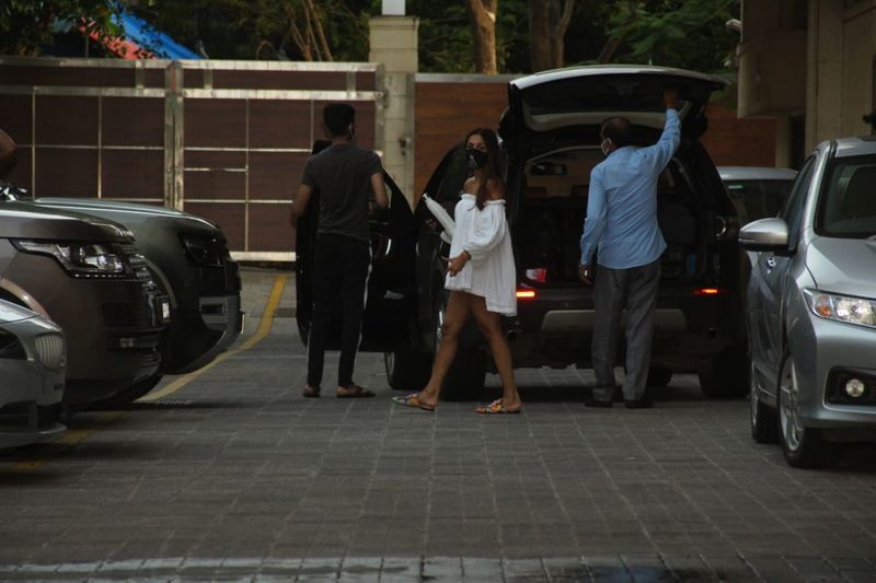 We just loved her look in a mini white dress. However, many social media users got confused that is it a top or a dress? 