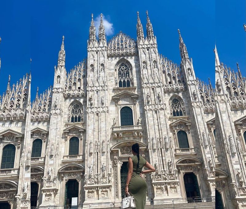 In the pictures, Georgina is seen standing in front of the famous catholic church, Duomo di Milano.