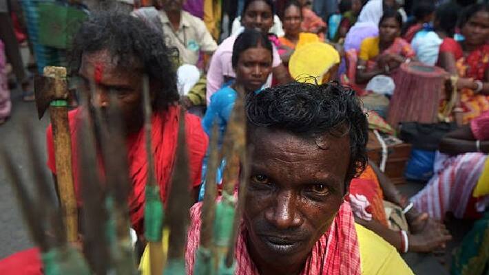tribals show protest bows and arrows against Land mafia bpsb tribals show protest bows and arrows against Land mafia bpsb