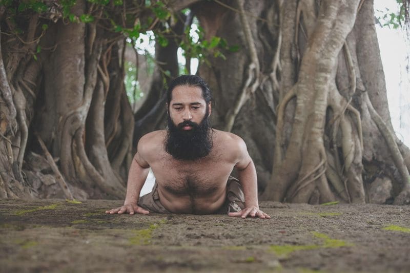 Cobra Pose (Bhujangasana)
Formation of the posture:
Lie down on your stomach with palms under your shoulders
Keep your feet together, with toes on the ground
Inhale completely (Purak), hold your breath (Kumbakh) and then lift your head, shoulders and torso up at a 30-degree angle
Keep your navel on the floor, broaden your shoulders and slightly raise your head
Slowly bring your torso down and then exhale breath (Rechak) – This breathing technique is therapeutic 