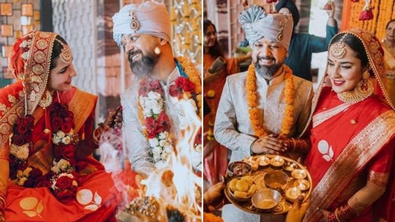 अंगीरा धर ने अपने इंस्टाग्राम पर शादी की फोटोज शेयर की है। इन फोटोज में दुल्हन बनी अंगीरा बेहद खूबसूरत नजर आ रही है। उन्होंने लाल रंग की सुनहरी बॉर्डर वाली साड़ी पहन रखी है। मांग टीका, हैवी नेकलेस-ईयरिंग्स और हाथों में भरी-भरी चूड़ियां पहन वे मुस्कराती नजर आई।