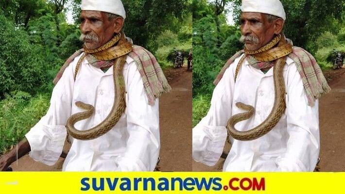Old Man Rides Cycle with Snake In Karnataka - bsb Old Man Rides Cycle with Snake In Karnataka - bsb