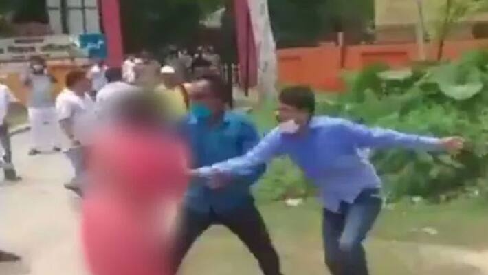 UP Shocker: On Camera, Samajwadi Worker's Sari Yanked By Political Rivals UP Shocker: On Camera, Samajwadi Worker's Sari Yanked By Political Rivals