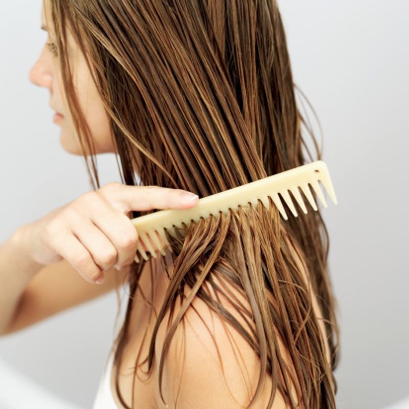 Comb the hair wet: This step is specially recommended for curly hair, but women with straight and wavy hair should actually adopt this too. When your hair is wet, it is more elastic and therefore resilient to combing. There is minimum breakage and hair fall when you comb your hair wet. Make sure to use a wide toothed comb is you have frizzy hair. There are also specific wet brush tools available in the market.
