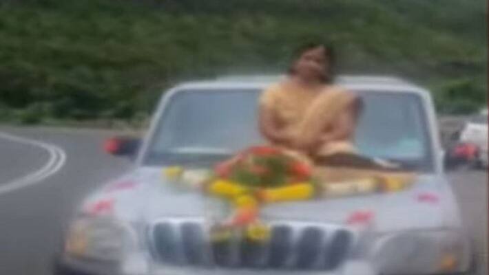 Bride travells on bonnet of the car for wedding pune police booked case under motor vehicle act ckm Bride travells on bonnet of the car for wedding pune police booked case under motor vehicle act ckm