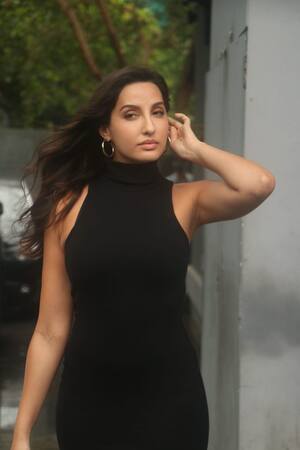 Nora Fatehi's Black Leather Dress May Seem Like Your Usual Suspect At  First, But Oh That Back!