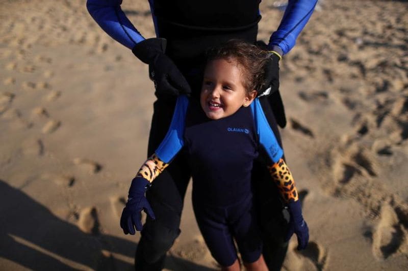 Nina a four year old girl try to remove marine plastic waste