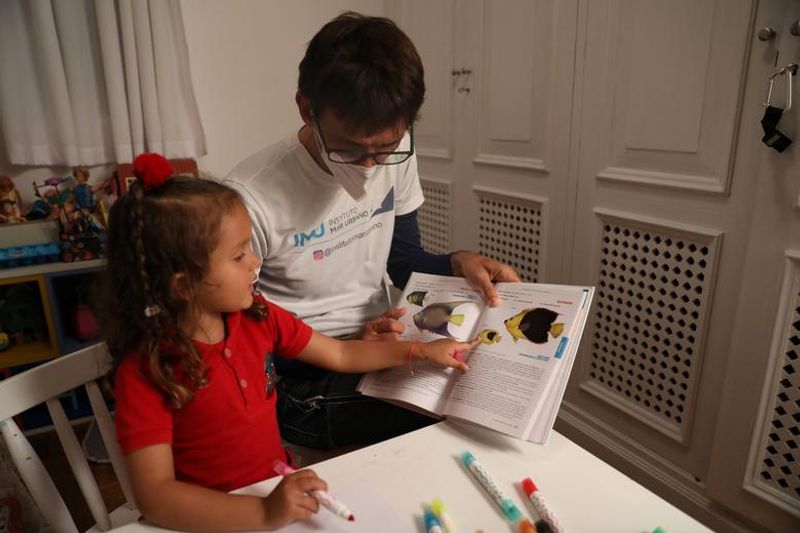 Nina a four year old girl try to remove marine plastic waste