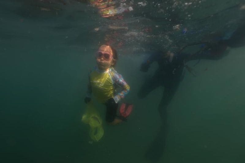 Nina a four year old girl try to remove marine plastic waste