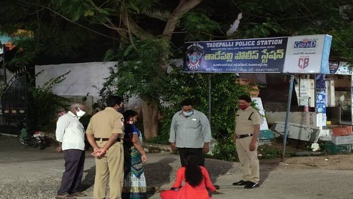 woman attempt to commit suicide by pouring petrol in front of police station, guntur - bsb woman attempt to commit suicide by pouring petrol in front of police station, guntur - bsb