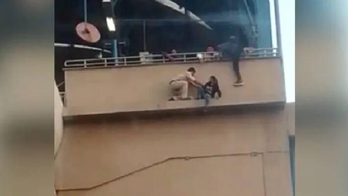 video in which woman tries to commit suicide but police constable rescued her video in which woman tries to commit suicide but police constable rescued her