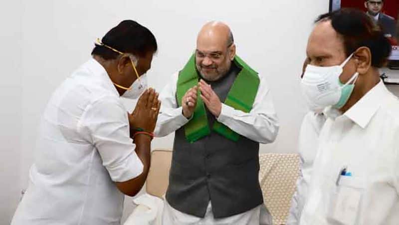 OPS  EPS  What was the background of the Amit Shah meeting?